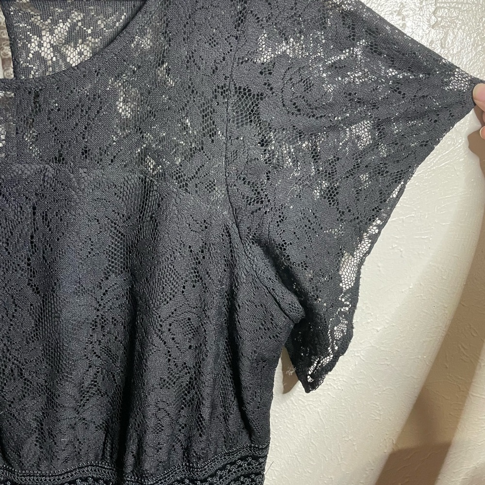Lacey black Torrid dress with flared sleeves